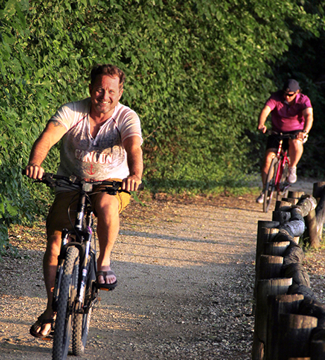 man riding bike on a trail at Anneberg Park 