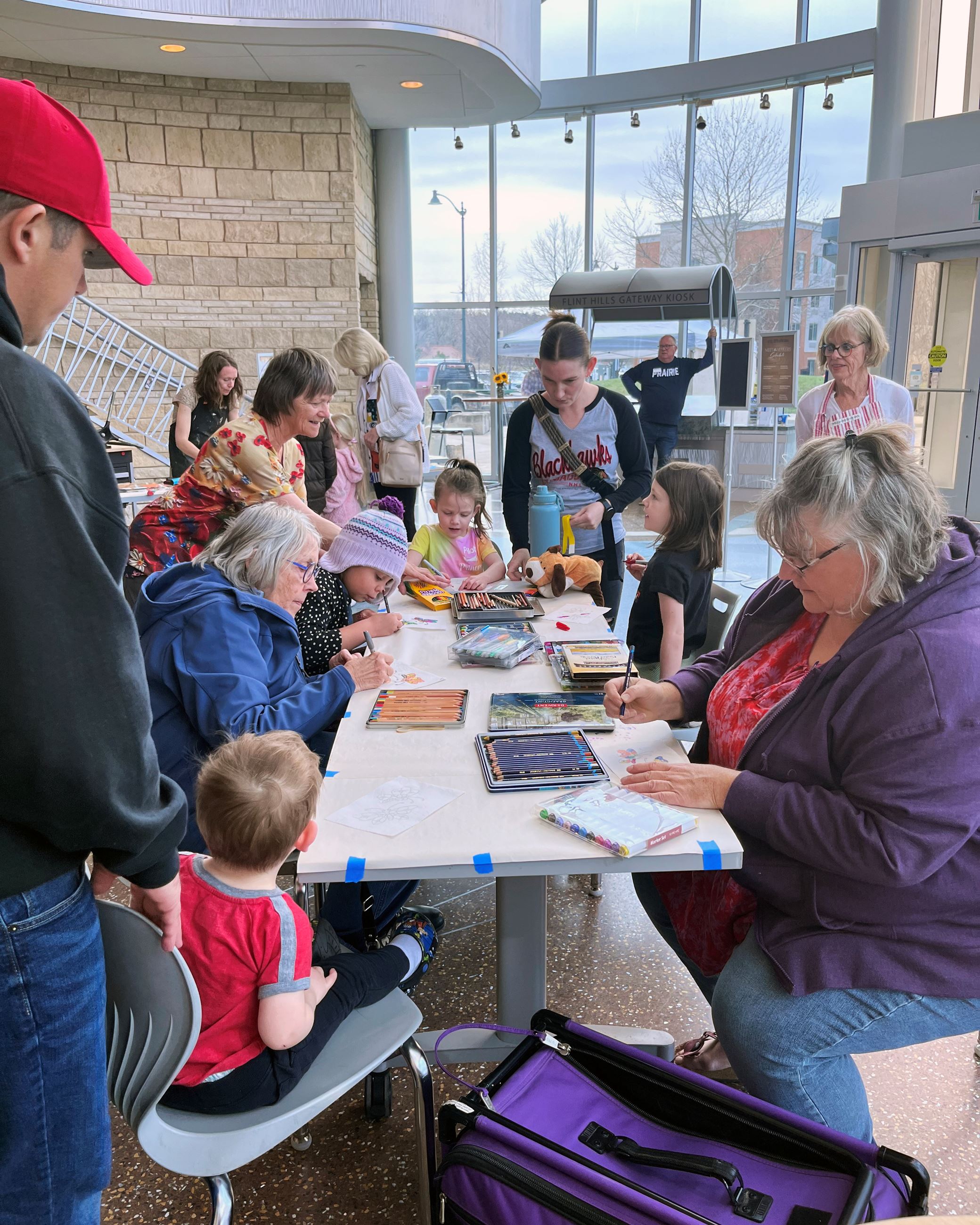Woman showing a group of people fabric painting